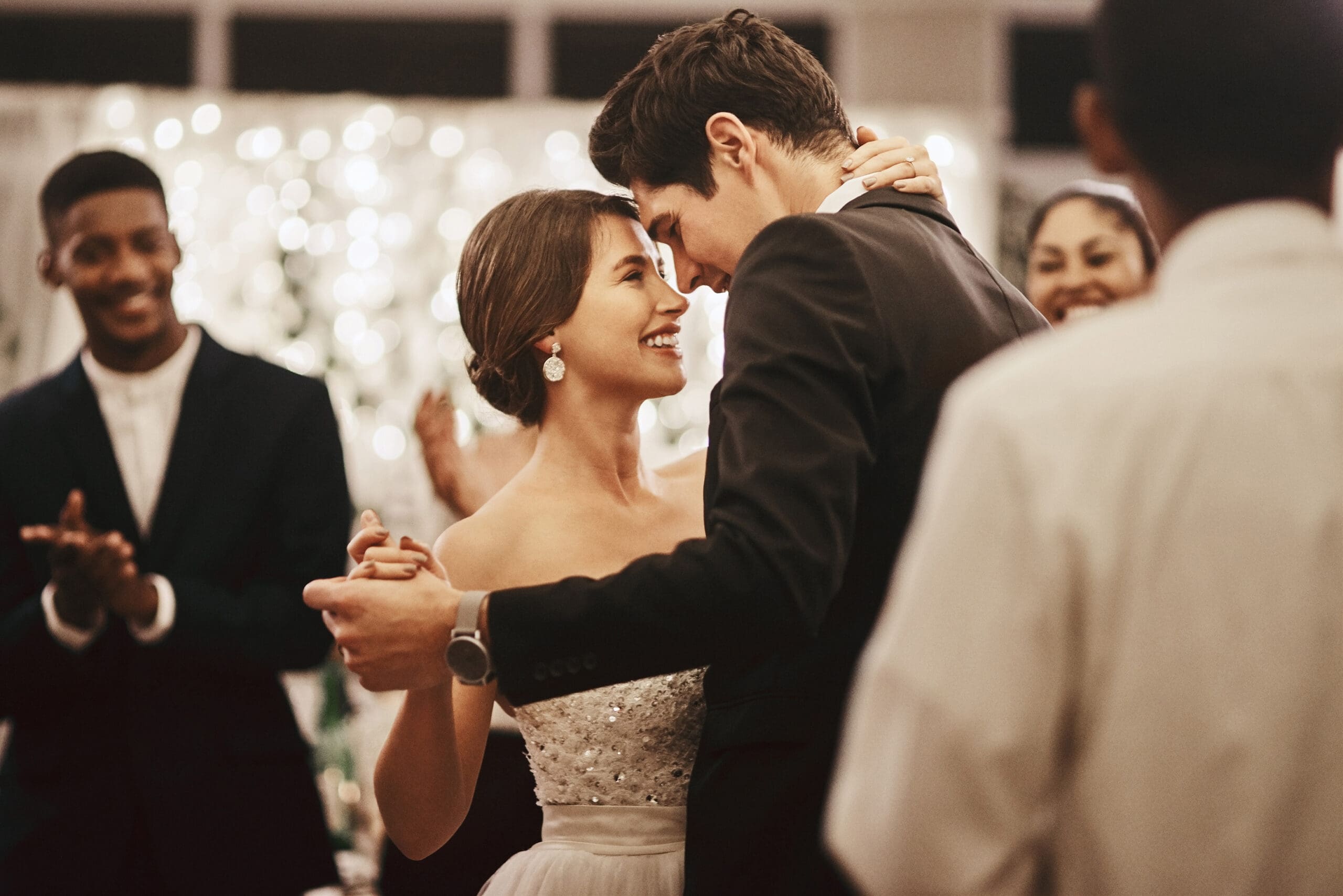 Cropped shot of an affectionate young newlywed couple dancing alongside their guests on their wedding day