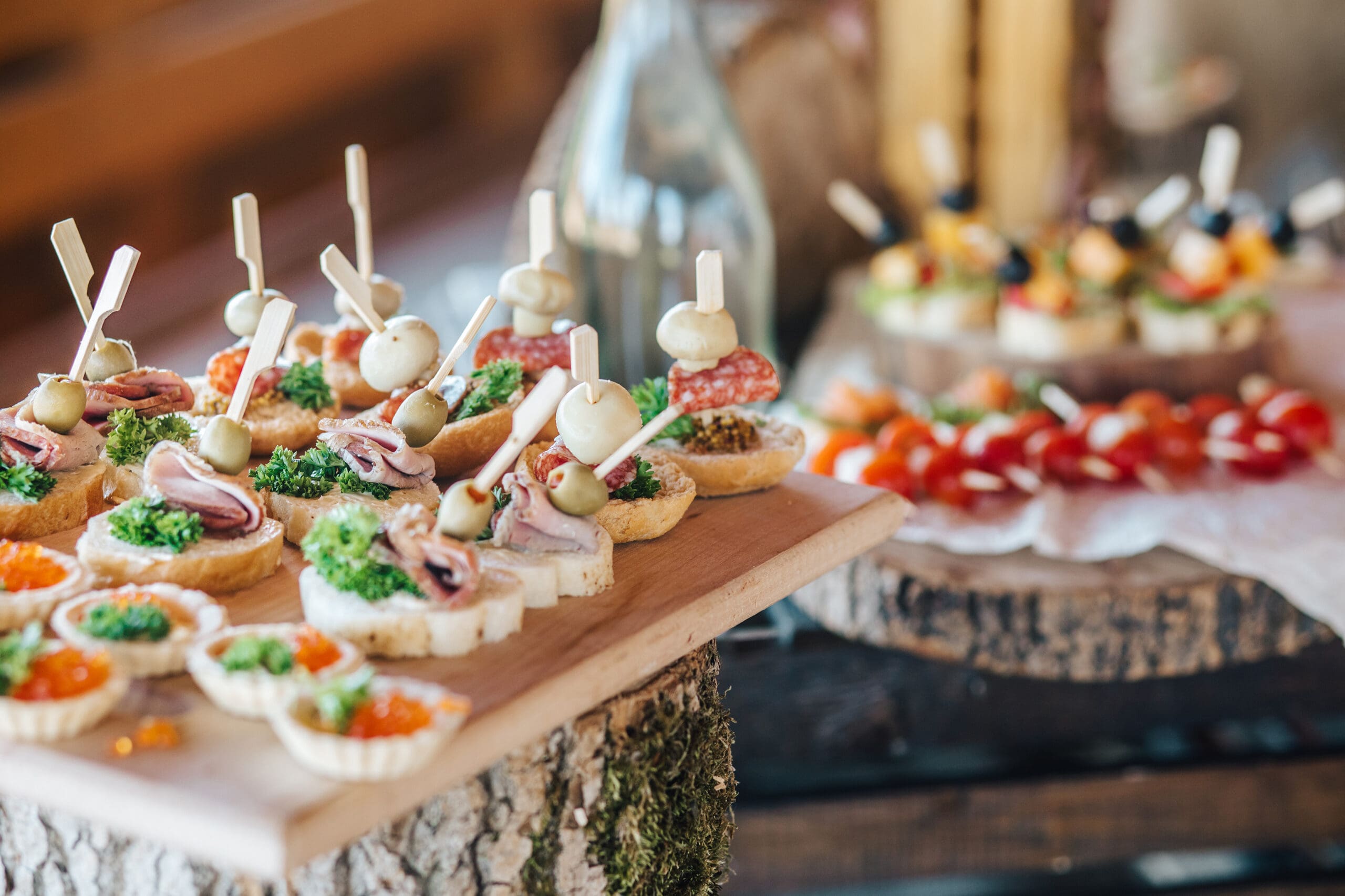 Beautifully decorated catering banquet table with different food snacks and appetizers on corporate christmas birthday party event or wedding celebration