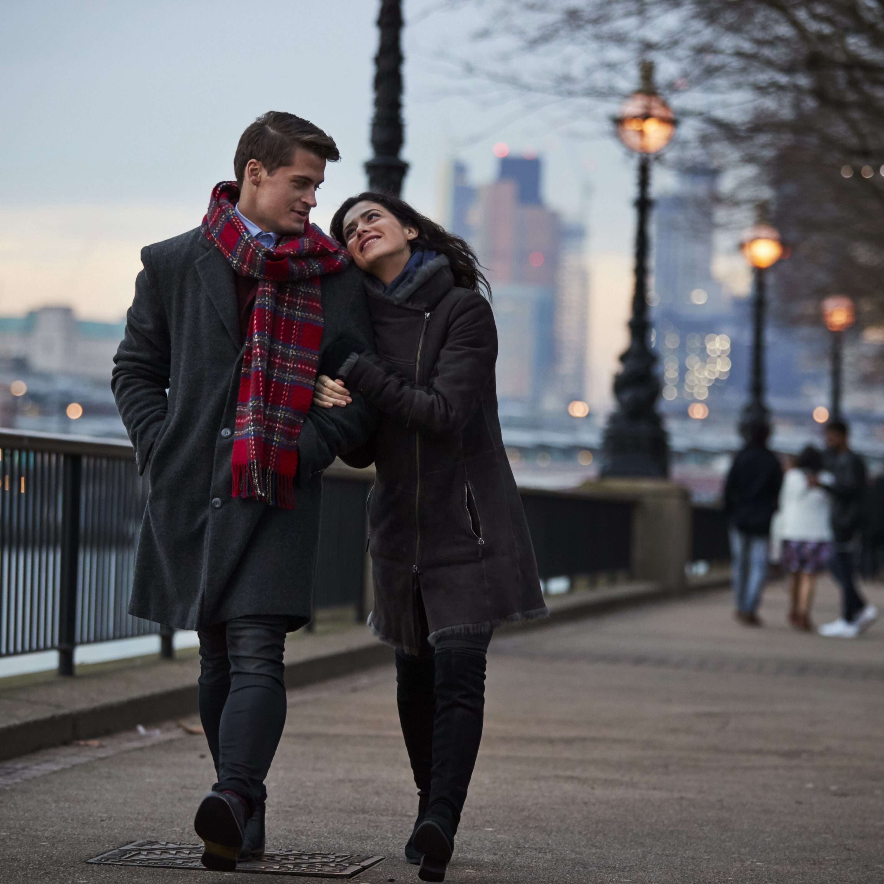 Couple walking through a city in the winter